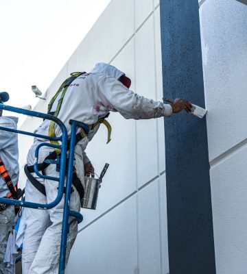Stephens-Commercial-Painting-Commercial-Exterior-Worker-painting-walls-of-Vandergriff-Honda-4-scaled-1